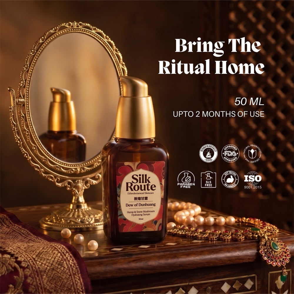 The Dew of Dunhuang 50 ml bottle in front of a gilt mirror with pearls and red silk, card titled Bring the Ritual Home, up to two months of use