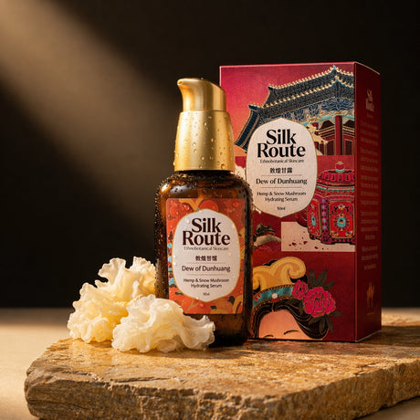 Dew of Dunhuang serum bottle beside its illustrated carton