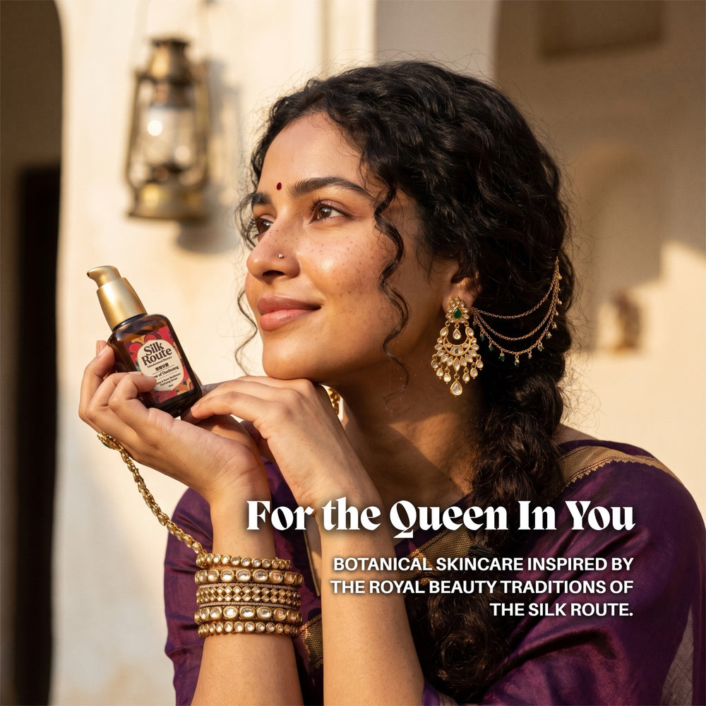 A woman in a purple silk sari holds the Dew of Dunhuang Snow Mushroom serum bottle to her chin, card titled For the Queen in You