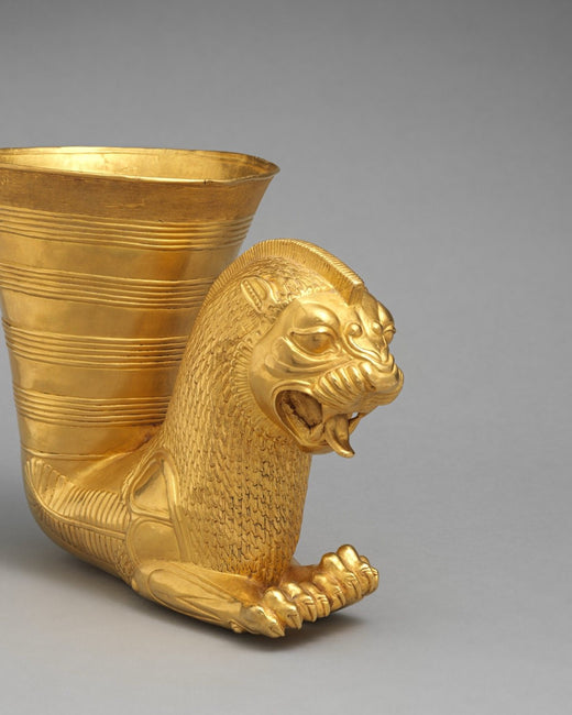 A gold drinking vessel ending in a lion, Achaemenid Persia, fifth century BCE